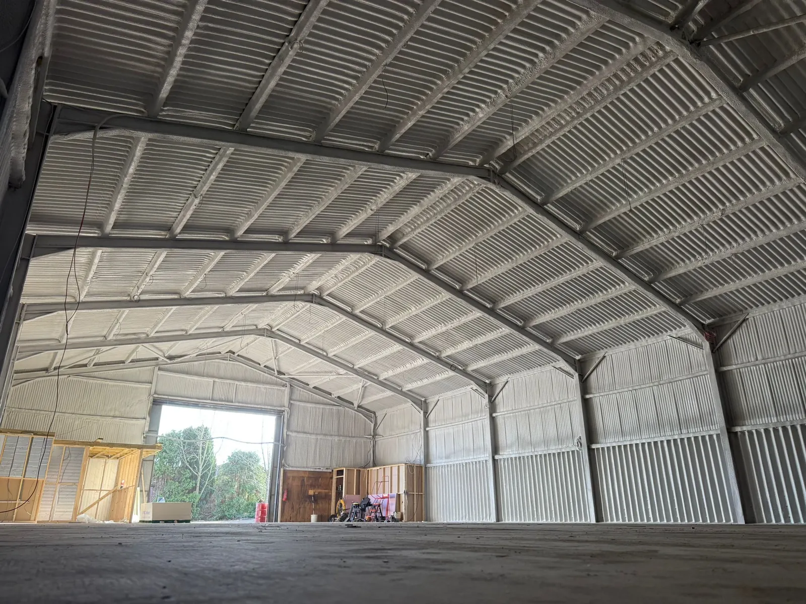Spray foam insulation applied to hangars — real Duratite Group project