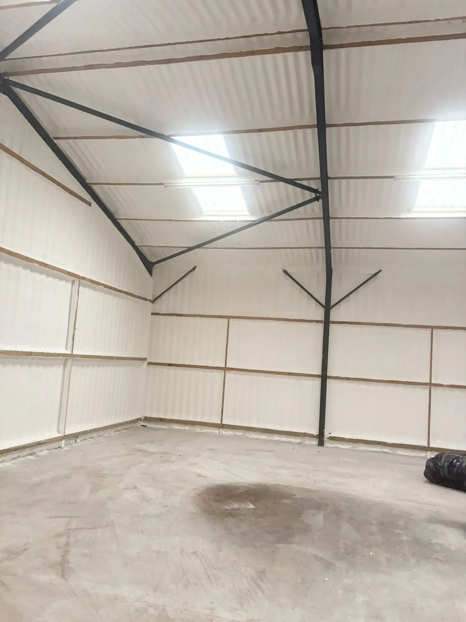 Spray foam insulation applied to hangars — real Duratite Group project