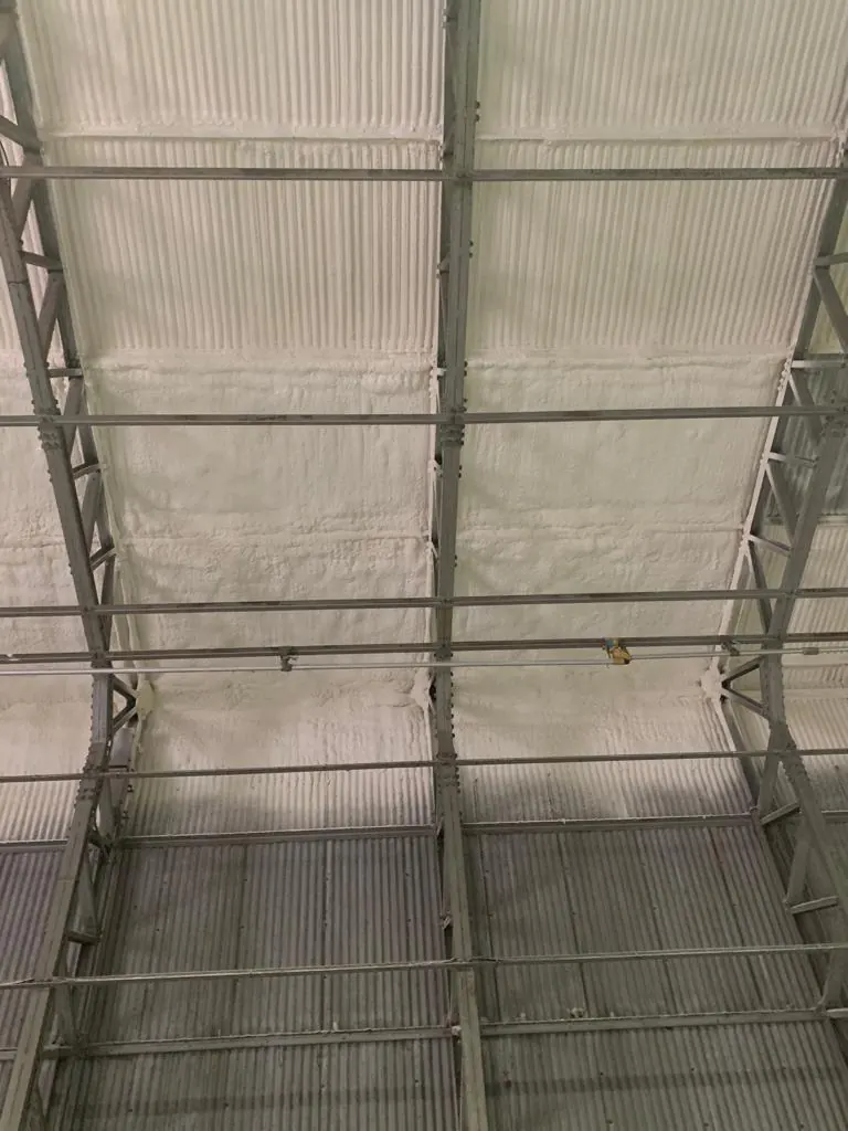 Spray foam insulation applied to asbestos roofs — real Duratite Group project