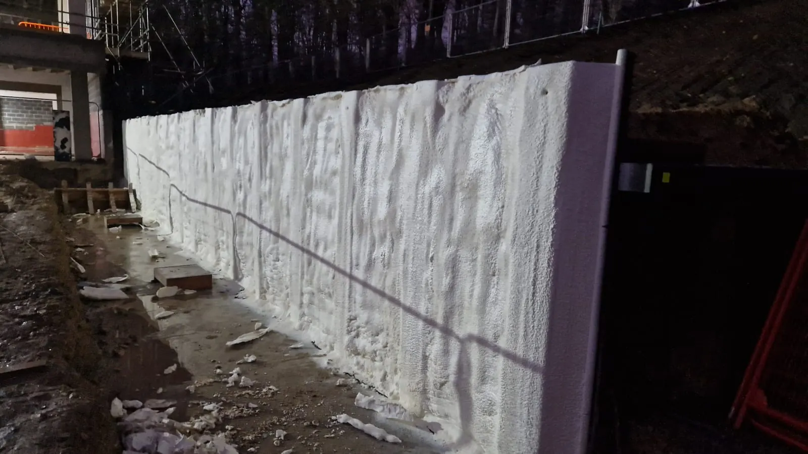 Spray foam insulation applied to piled walls — real Duratite Group project