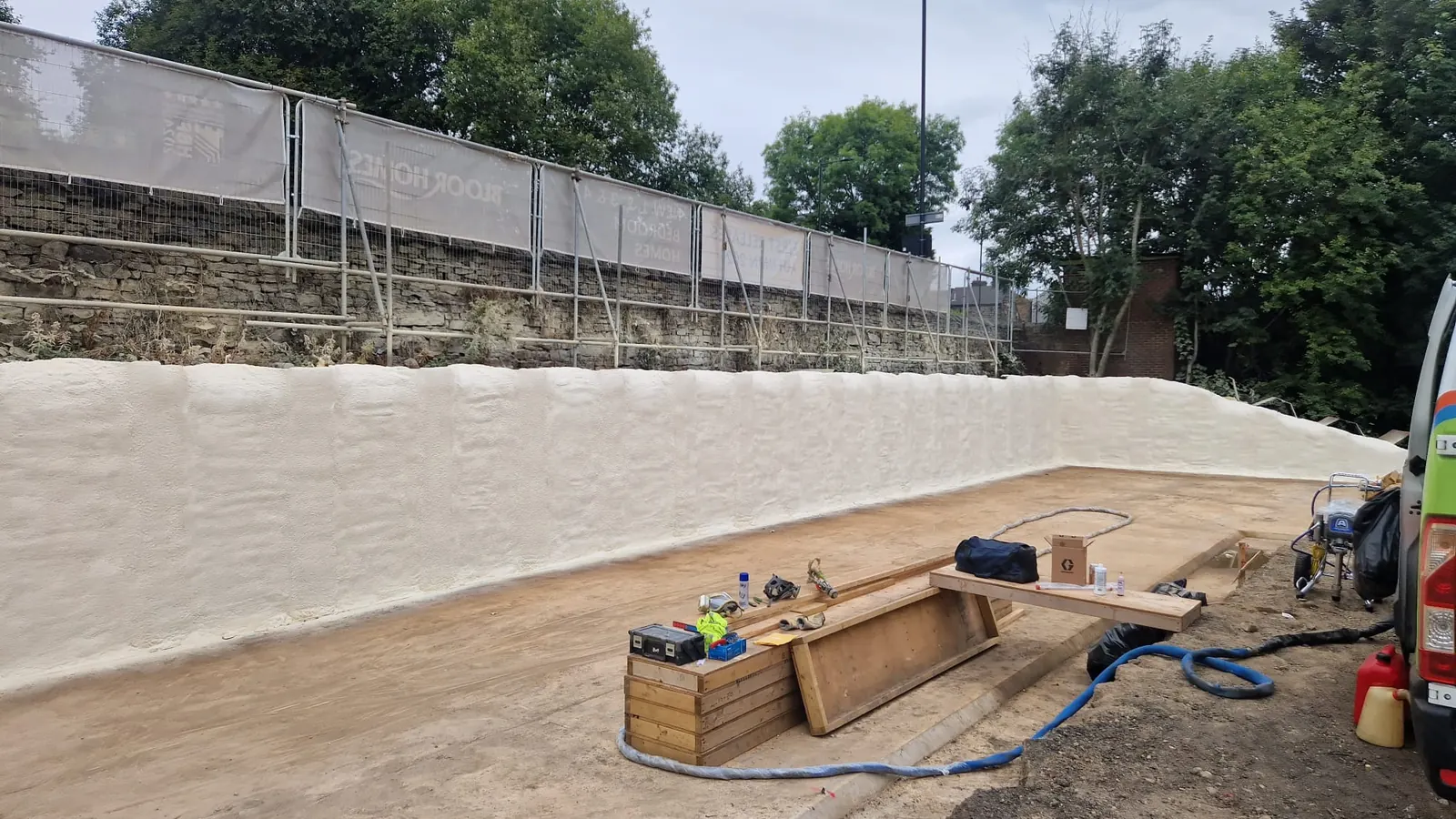 Spray foam insulation applied to suspended floors — real Duratite Group project