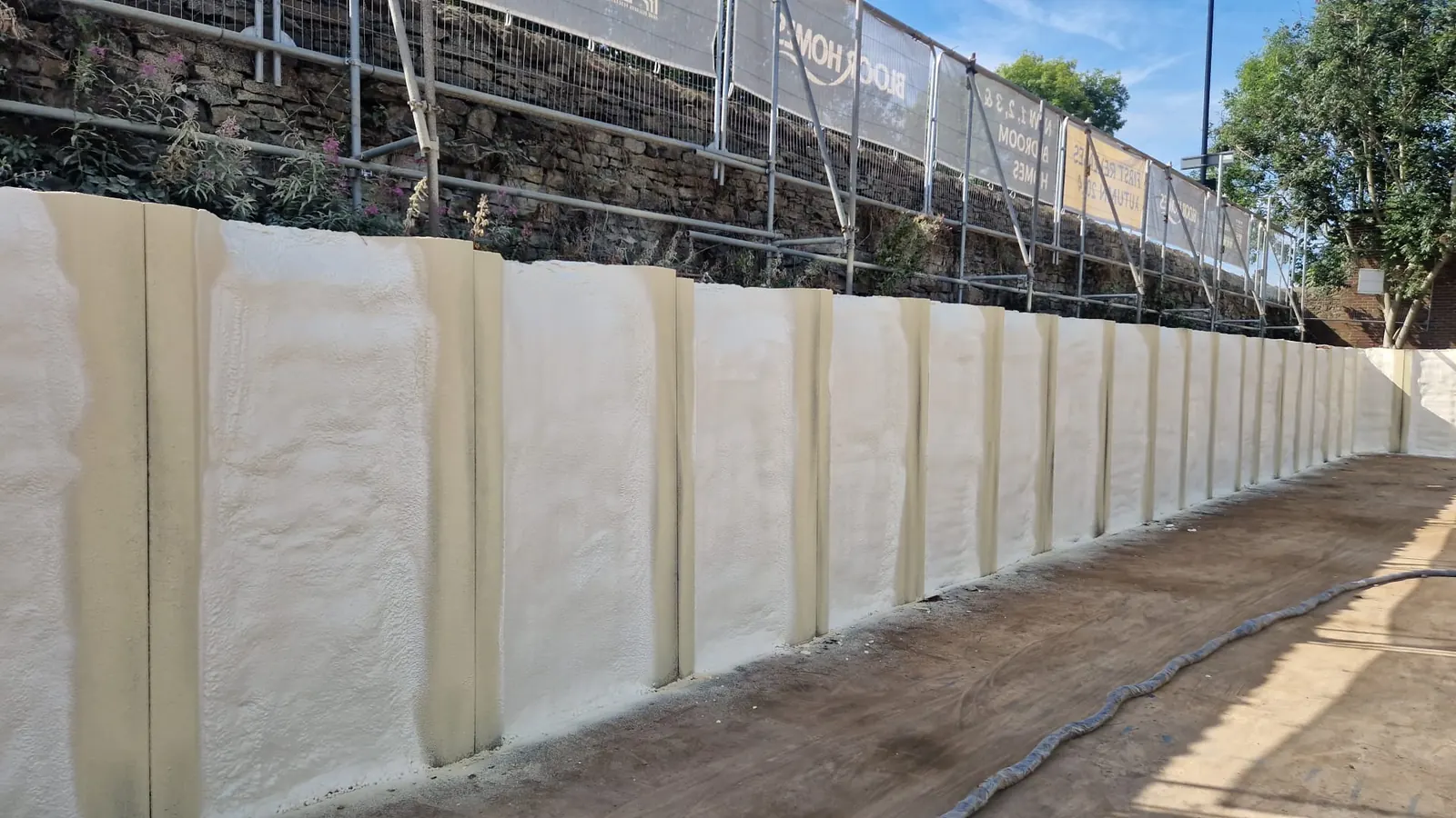 Spray foam insulation applied to suspended floors — real Duratite Group project