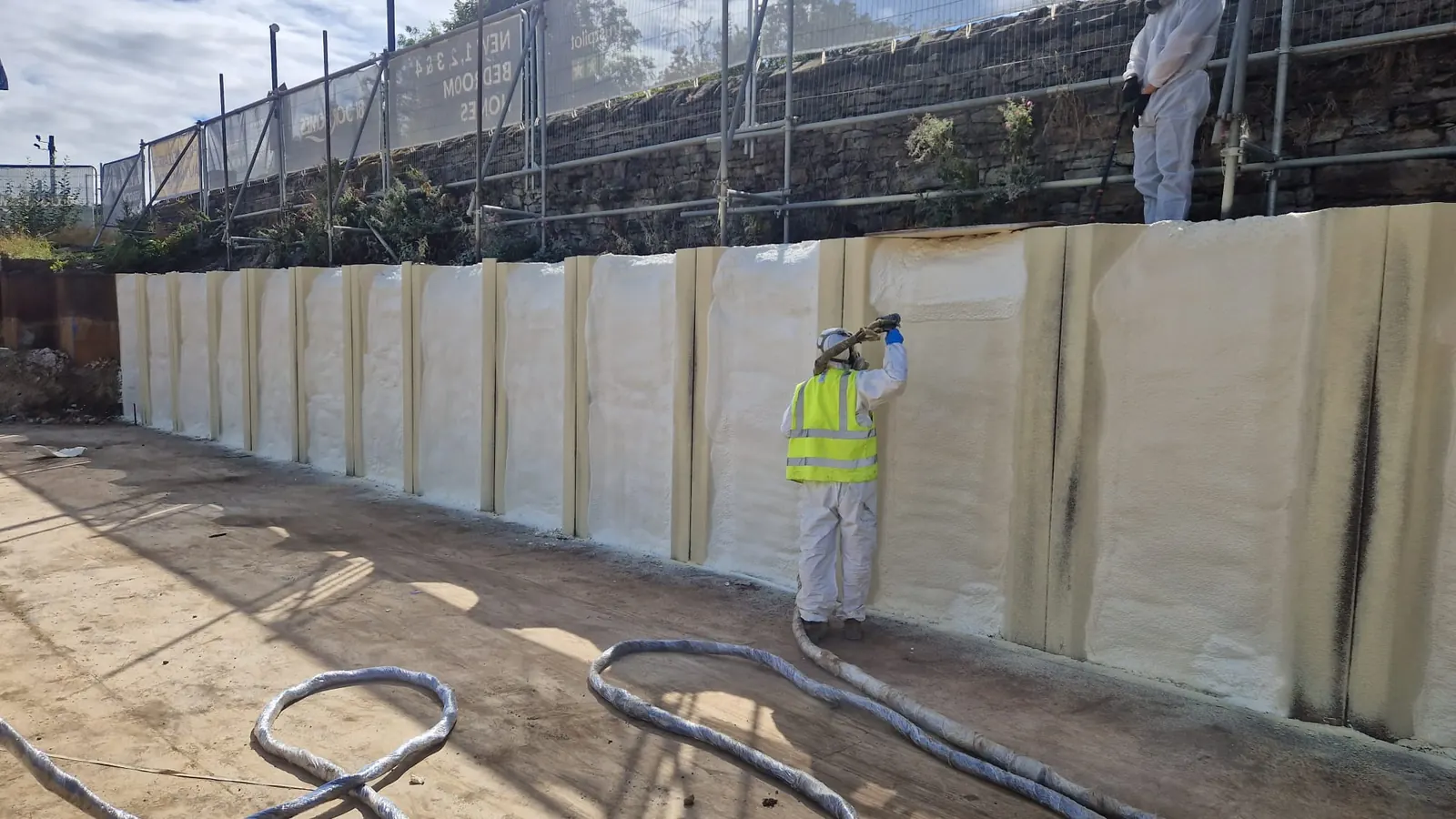 Spray foam insulation applied to suspended floors — real Duratite Group project