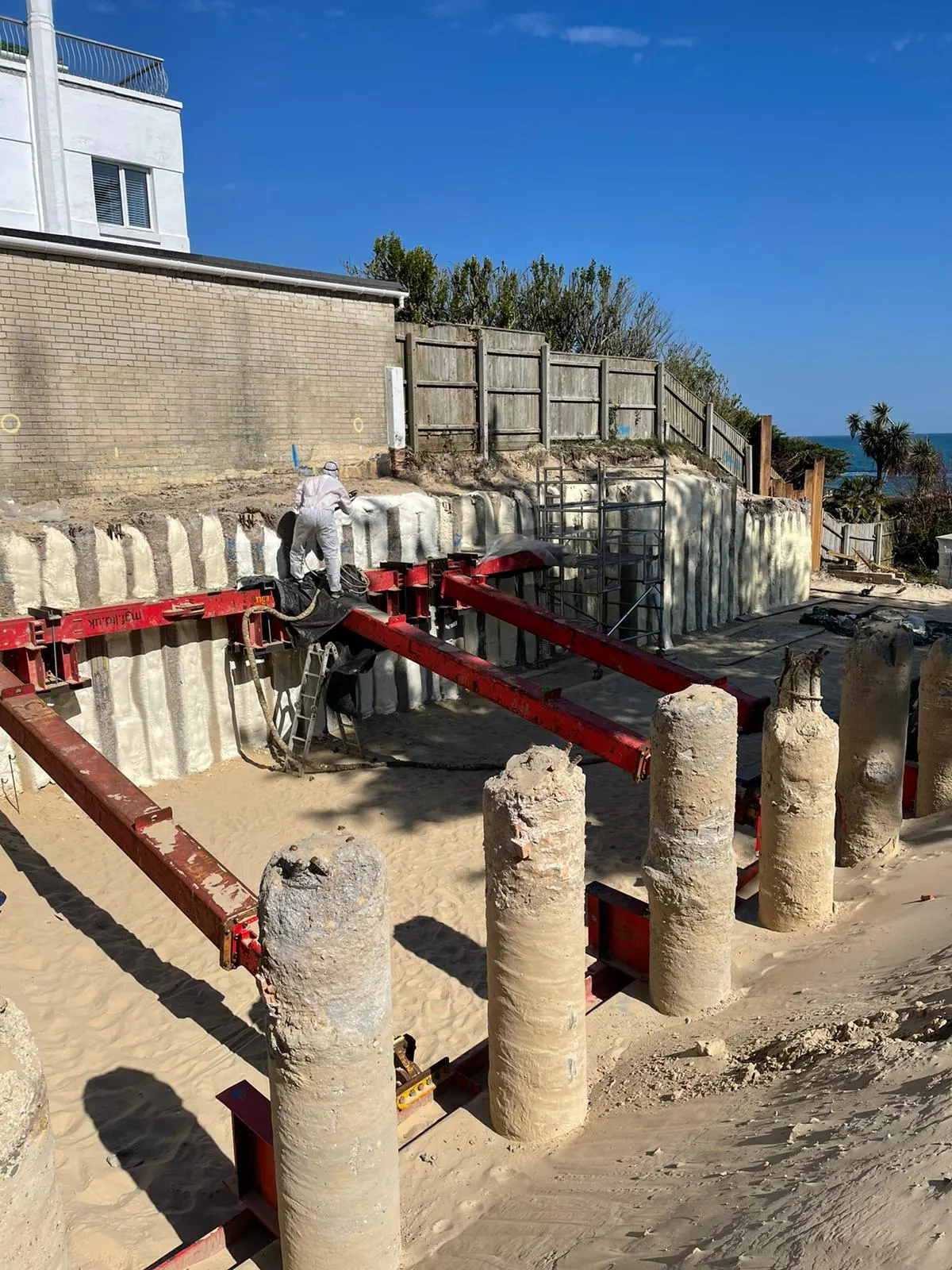 Spray foam insulation applied to suspended floors — real Duratite Group project