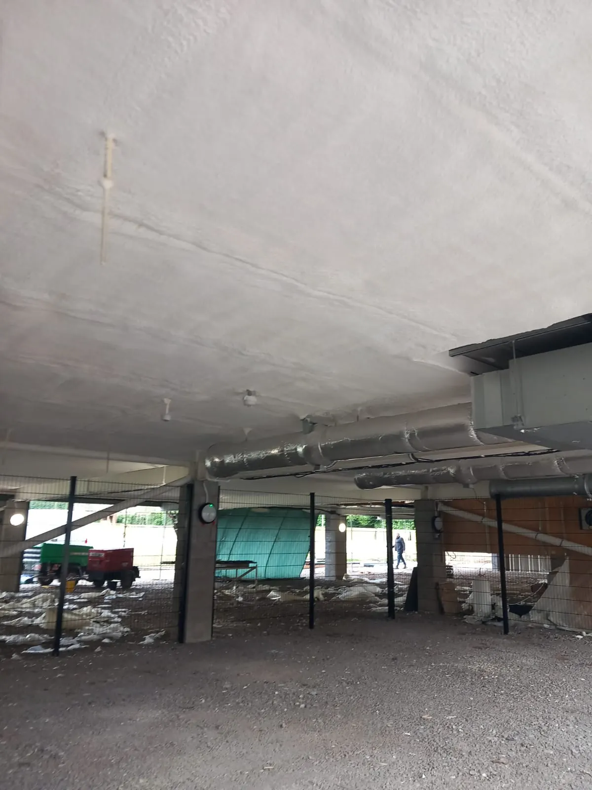 Spray foam insulation applied to concrete soffits — real Duratite Group project