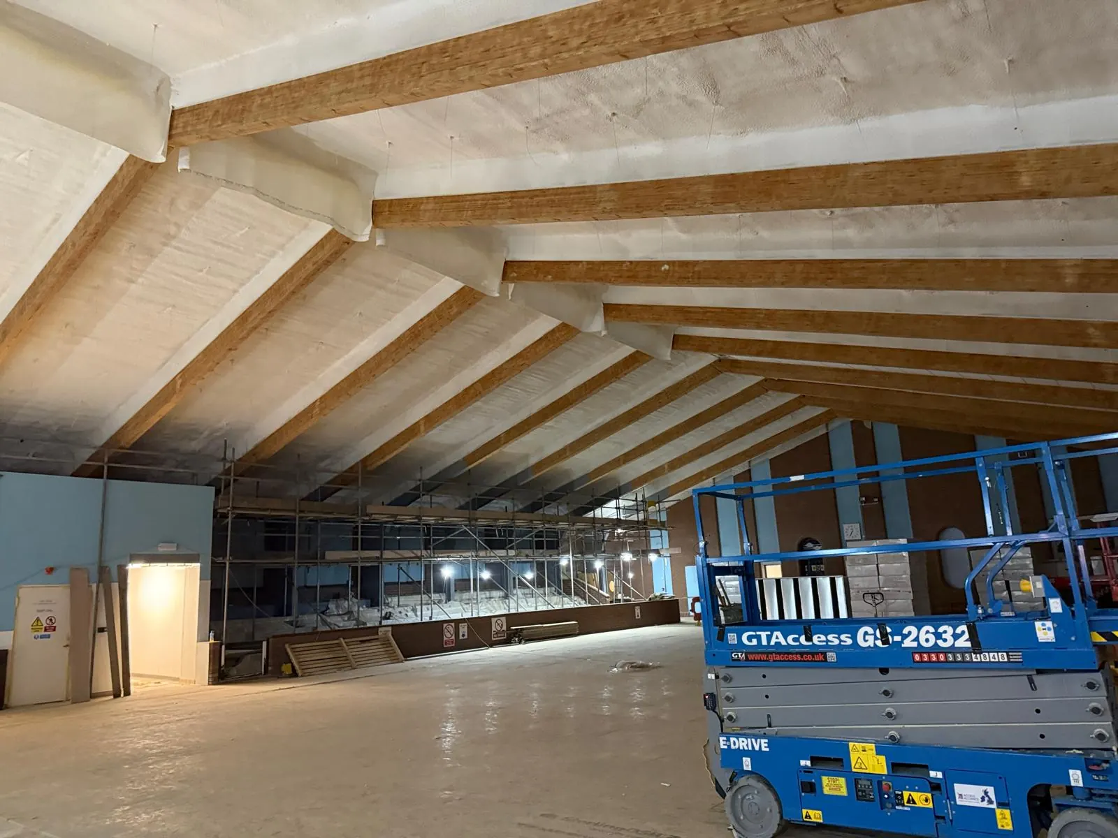Spray foam insulation applied to pool halls — real Duratite Group project